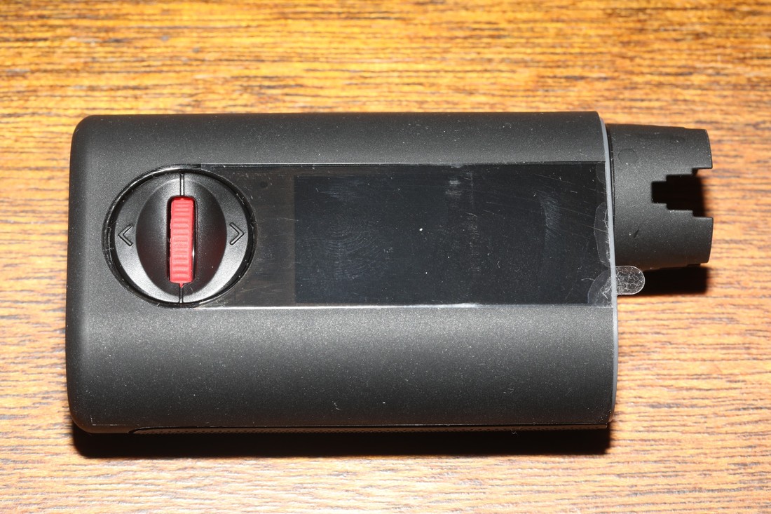 Roadie-4 guitar tuner photographed on a wooden surface.
